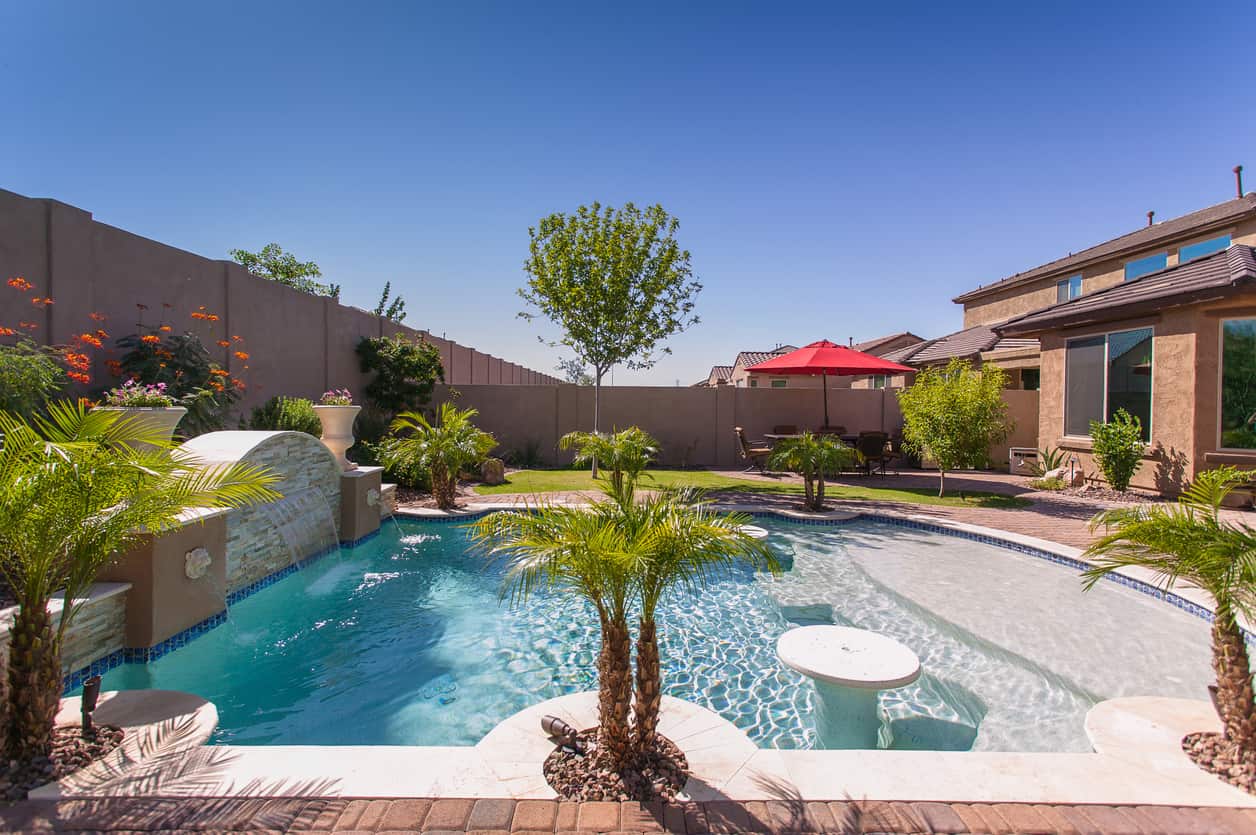 Modern Resort Pool with Travertine Patio